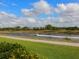 Scenic waterfront view featuring a canal with a boat cruising along the calm waters on a sunny day at 2217 Muesel St, Sarasota, FL 34237