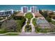 Wide aerial view of the towers, tennis courts, and beautifully landscaped grounds at 2295 Gulf Of Mexico Dr # 64S, Longboat Key, FL 34228