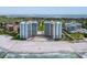 Aerial view of Gulf-front condominiums with a community pool and convenient beach access at 2295 Gulf Of Mexico Dr # 64S, Longboat Key, FL 34228