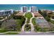 Aerial view showcasing the towers, grounds, and beach access at 2295 Gulf Of Mexico Dr # 64S, Longboat Key, FL 34228