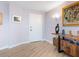 Inviting condo entryway with hardwood floors, modern decor, and a stylish console table at 2295 Gulf Of Mexico Dr # 64S, Longboat Key, FL 34228