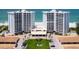 Exterior front view of the condo towers with well-maintained landscaping at 2295 Gulf Of Mexico Dr # 64S, Longboat Key, FL 34228