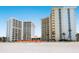 Stunning beachfront condo buildings with balconies and ocean views from sandy beach at 2295 Gulf Of Mexico Dr # 64S, Longboat Key, FL 34228