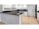Well-lit kitchen with modern appliances, sleek countertops, and ample cabinet space at 2295 Gulf Of Mexico Dr # 64S, Longboat Key, FL 34228