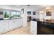 Open-concept living space with views, featuring modern kitchen and dining areas at 2295 Gulf Of Mexico Dr # 64S, Longboat Key, FL 34228