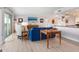 Spacious living room with a modern design, hardwood floors, and balcony access offering scenic views at 2295 Gulf Of Mexico Dr # 64S, Longboat Key, FL 34228