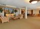 Comfortable lounge area featuring wicker furniture and decorative accents at 2295 Gulf Of Mexico Dr # 64S, Longboat Key, FL 34228