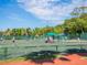 Active tennis courts surrounded by lush greenery, offering a great recreational amenity at 2295 Gulf Of Mexico Dr # 64S, Longboat Key, FL 34228