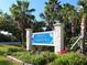 Welcome to the Town of Longboat Key sign with colorful flowers and lush landscaping at 2295 Gulf Of Mexico Dr # 64S, Longboat Key, FL 34228