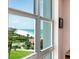 Exterior building view of the beach, lawn, and the ocean from the apartment at 2295 Gulf Of Mexico Dr # 64S, Longboat Key, FL 34228