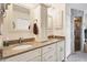 Bathroom featuring dual sinks, granite countertops, and a step-in shower at 2381 Appaloosa Cir, Sarasota, FL 34240