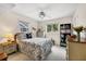 Bright bedroom with ceiling fan, carpet, and two windows at 2381 Appaloosa Cir, Sarasota, FL 34240