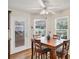 Dining area with wood floors, backyard views, and ceiling fan at 2381 Appaloosa Cir, Sarasota, FL 34240