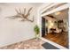 Inviting entryway with decorative wall art and a view into the bright, open living space at 2381 Appaloosa Cir, Sarasota, FL 34240