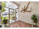Welcoming foyer with brick flooring, ornamental accents, and views to the outside at 2381 Appaloosa Cir, Sarasota, FL 34240