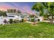 Charming single-story home with manicured lawn, mature trees, and attractive landscaping at 2381 Appaloosa Cir, Sarasota, FL 34240