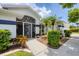 Charming home featuring a landscaped front entrance with mature shrubs and well-maintained walkway leading to the front door at 2381 Appaloosa Cir, Sarasota, FL 34240
