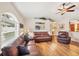 Spacious living room features wood floors, high ceilings, and leather sofas at 2381 Appaloosa Cir, Sarasota, FL 34240
