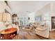 Bright living room features hardwood floors, vaulted ceilings, and comfortable seating at 2381 Appaloosa Cir, Sarasota, FL 34240