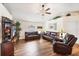 Spacious living room features wood floors, high ceilings, and leather sofas at 2381 Appaloosa Cir, Sarasota, FL 34240