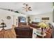 Spacious living room features wood floors, high ceilings, and leather sofas at 2381 Appaloosa Cir, Sarasota, FL 34240