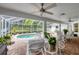 Inviting covered pool area featuring brick pavers and lush landscaping at 2381 Appaloosa Cir, Sarasota, FL 34240