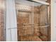 Elegant shower features tiled walls, glass door, and safety bars at 2381 Appaloosa Cir, Sarasota, FL 34240
