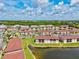 A bird's-eye view of the condo community, showcasing its multiple buildings, landscaping, and waterway at 25100 Sandhill Blvd # 104 G, Punta Gorda, FL 33983