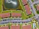 Aerial top down view of the condo community with a center pond and community pool at 25100 Sandhill Blvd # 104 G, Punta Gorda, FL 33983