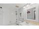 Bathroom featuring a shower-tub combination, white vanity with decorative mirror and updated fixtures at 25100 Sandhill Blvd # 104 G, Punta Gorda, FL 33983