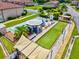 Aerial view of bocce ball and shuffleboard courts, a gazebo, and condo units at 25100 Sandhill Blvd # 104 G, Punta Gorda, FL 33983