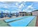 Shuffleboard court with umbrellas, seating and gathering area at 25100 Sandhill Blvd # 104 G, Punta Gorda, FL 33983