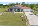 Expansive lawn showcasing a well-maintained property with solar panels at 25324 Alicante Dr, Punta Gorda, FL 33955