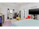 This bedroom has a ceiling fan, carpeted floors, and ample natural light at 25324 Alicante Dr, Punta Gorda, FL 33955