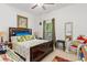 Bright bedroom with a large bed, overhead fan, lots of natural light and decorative touches at 25324 Alicante Dr, Punta Gorda, FL 33955