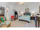 This bedroom has a ceiling fan, carpeted floors, and ample natural light at 25324 Alicante Dr, Punta Gorda, FL 33955