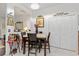 A cozy dining area is complemented by a decorative display and bright, airy feel at 25324 Alicante Dr, Punta Gorda, FL 33955