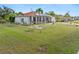 Charming single-story home with a well-maintained lawn and mature landscaping at 25324 Alicante Dr, Punta Gorda, FL 33955