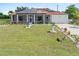 Well-manicured lawn and mature landscaping at 25324 Alicante Dr, Punta Gorda, FL 33955