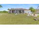 Attractive single-story home with screened porch and beautifully landscaped front yard at 25324 Alicante Dr, Punta Gorda, FL 33955