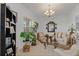 The living room is bathed in natural light and features a chandelier at 25324 Alicante Dr, Punta Gorda, FL 33955