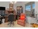 Well-decorated office space with a large desk, filing cabinets, and a comfortable reading chair at 25324 Alicante Dr, Punta Gorda, FL 33955