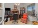 Well-decorated office space with a large desk, filing cabinets, and a comfortable reading chair at 25324 Alicante Dr, Punta Gorda, FL 33955