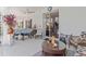 Covered patio area with comfortable seating and ceiling fan, perfect for entertaining outdoors at 25324 Alicante Dr, Punta Gorda, FL 33955