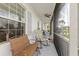 Inviting screened porch with comfortable seating and a ceiling fan at 25324 Alicante Dr, Punta Gorda, FL 33955