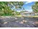 Expansive backyard with partially cleared lot offers plenty of space for outdoor activities and customization at 2622 11Th W Ave, Bradenton, FL 34205