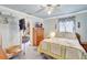 Cozy bedroom features comfortable bed, wooden dresser, and access to walk-in closet at 2622 11Th W Ave, Bradenton, FL 34205