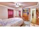 Bedroom with decorative details, tiled floor, dresser, and closet at 2622 11Th W Ave, Bradenton, FL 34205