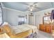 Relaxing bedroom with bed, dresser, neutral walls, and tiled flooring at 2622 11Th W Ave, Bradenton, FL 34205