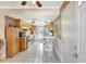 Traditional eat-in kitchen featuring wood cabinets, white appliances, and tile floors for easy maintenance at 2622 11Th W Ave, Bradenton, FL 34205
